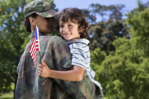 Soldier reunited with her son on a sunny day