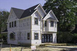 A construction site for a new single family home in Rochester, Michigan. A recent trend is to tear down older homes in smaller, but liveable communities, and replace them with large, modern homes.